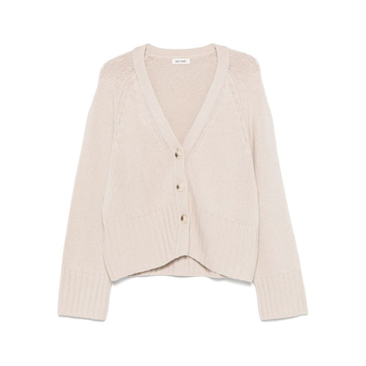 SOFT GOAT Sweaters Ivory cashmere cardigan with V-neck, long sleeves, ribbed trim, and front button fastening in light beige.