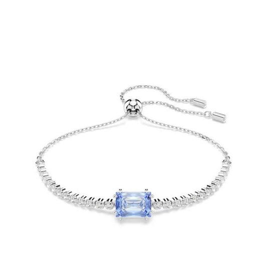 Elegant silver bracelet with blue gemstone centerpiece, showcasing timeless design and exquisite craftsmanship.