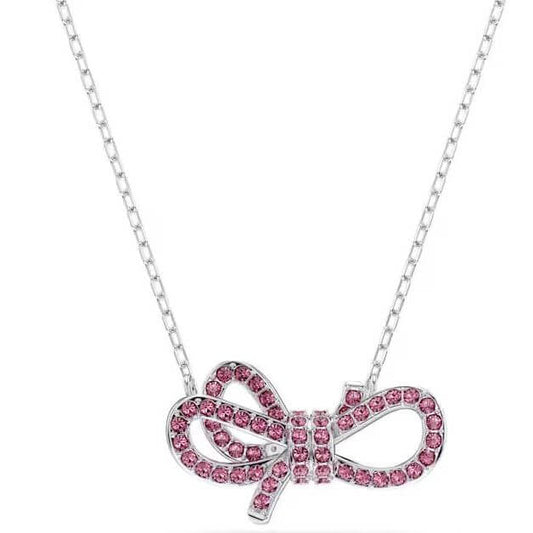 SWAROVSKI Mod. 5723556 Lifelong Bow Collection pendant necklace with pink pavé crystals in bow motif.