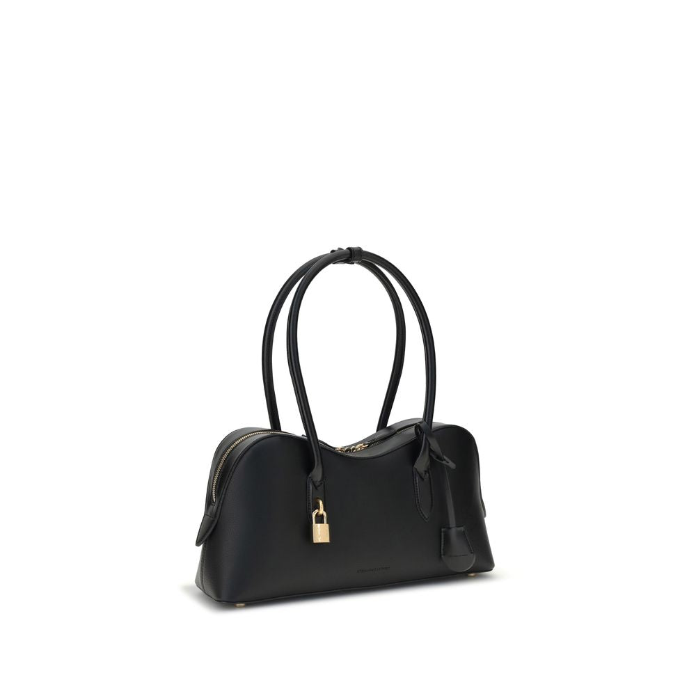 Stella McCartney Black Nylon Shoulder Bag with logoed padlock, round handles, and zippered closure, featuring sustainable leatherette material.
