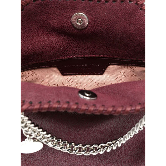 Stella McCartney Falabella Tiny crossboydy bag in bordeaux red with chain-link handles, magnetic fastening, and logo charm, inside view.