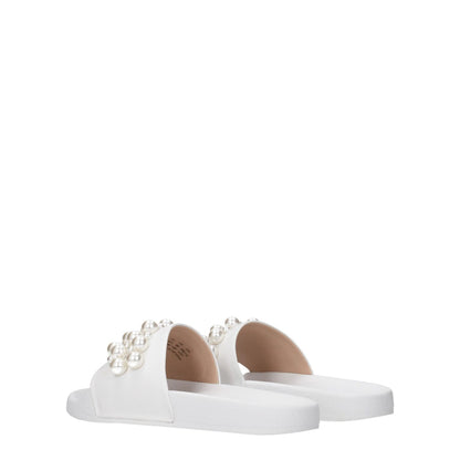 Stuart Weitzman White Leather Slippers with front detail and pearl accents; open toe, low flat heel, rubber sole.