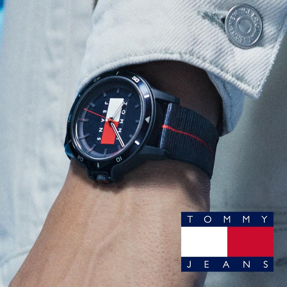 Stylish TOMMY HILFIGER Mod. 1791997 watch with quartz analog movement and multifunction features on wrist with Tommy Jeans logo.