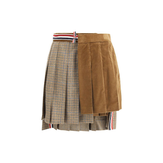 Thom Browne Brown Wool Mini Skirt with pleated velvet and houndstooth layers, iconic striped band, and side pockets for style and function.