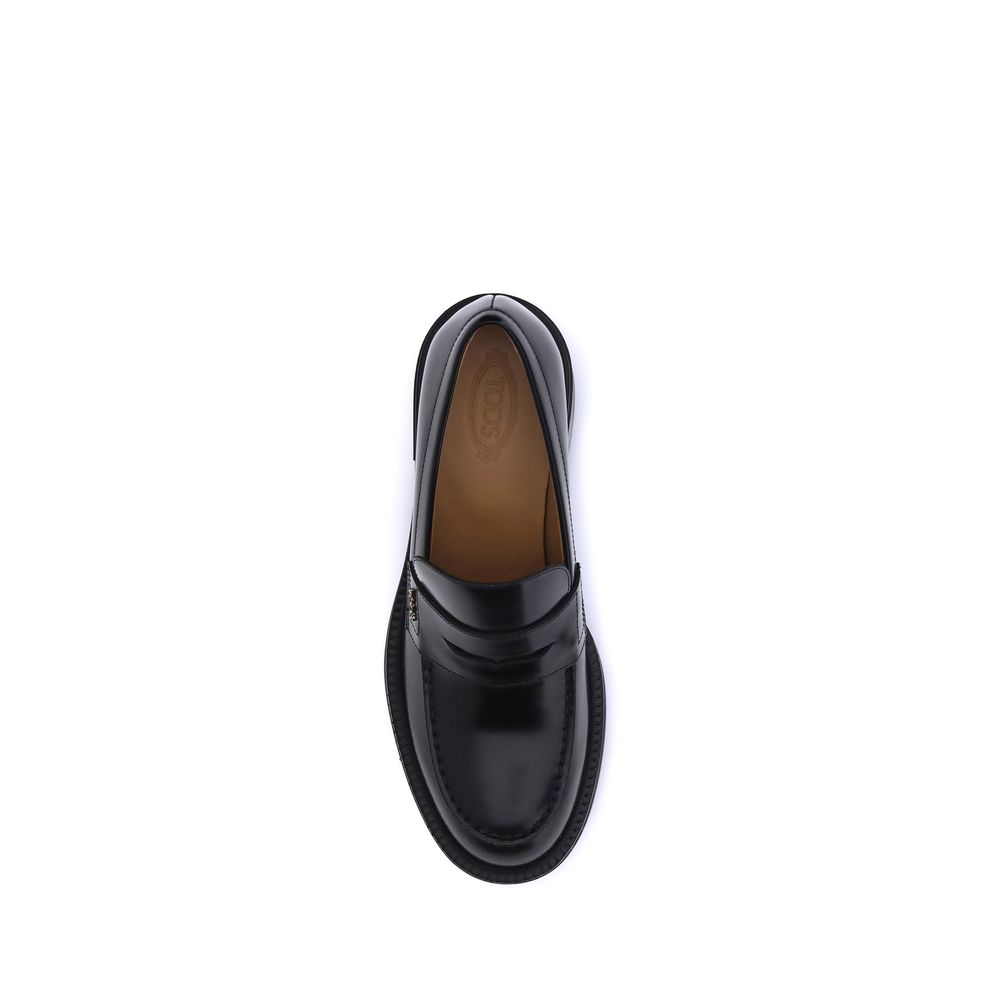 Top view of Tod's Black Calf Leather Bos Taurus Platform Loafers with round toe and chunky heel, showcasing sleek leather design.