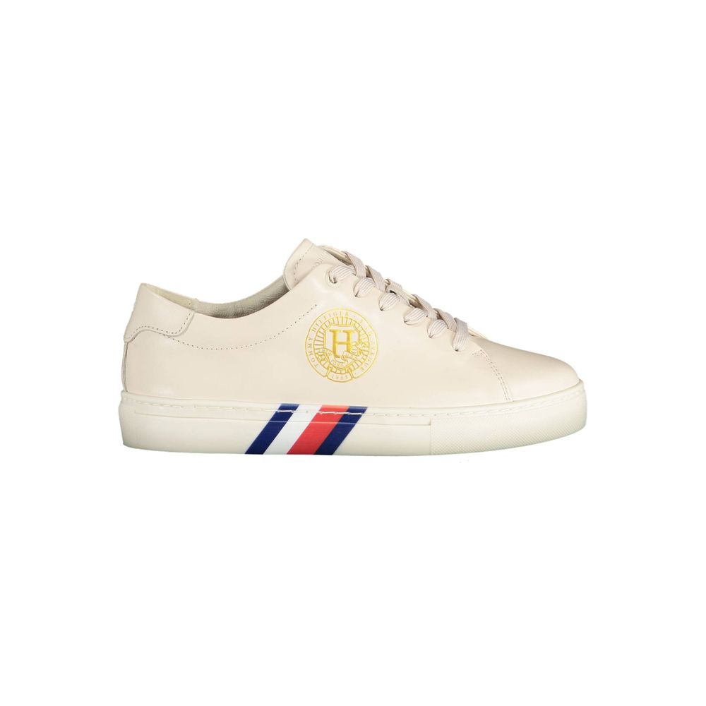 Tommy Hilfiger Beige Leather Women Sneaker with iconic logo, contrasting details, and 100% organic cotton design, perfect for urban style.
