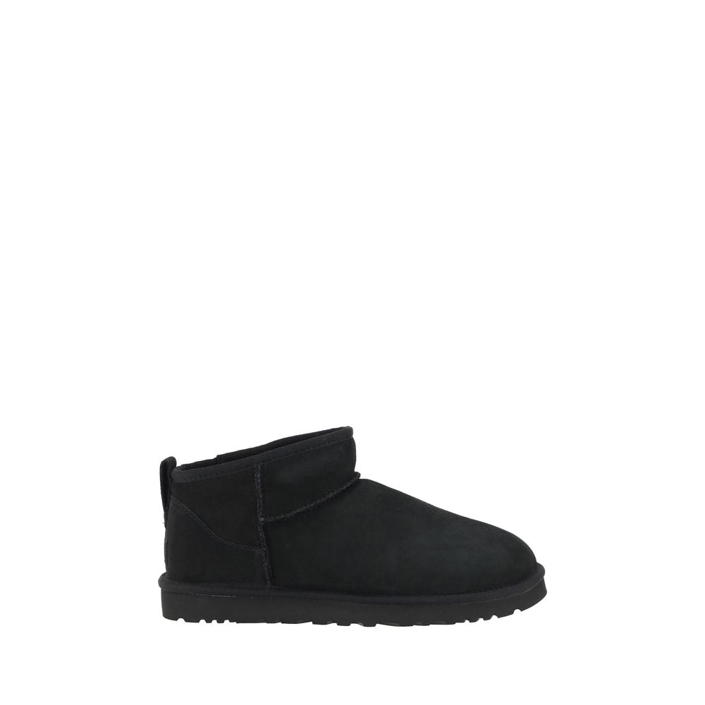 UGG Black Goatskin Ankle Boots with shearling lining, round toe, suede design, knurled sole, and iconic monogram on heel.