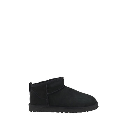 UGG Black Goatskin Ankle Boots with shearling lining, round toe, suede design, knurled sole, and iconic monogram on heel.