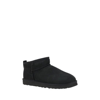 Alt Tag: UGG Black Goatskin Ankle Boots with shearling lining and knurled sole for grip and durability, featuring iconic monogram on heel.