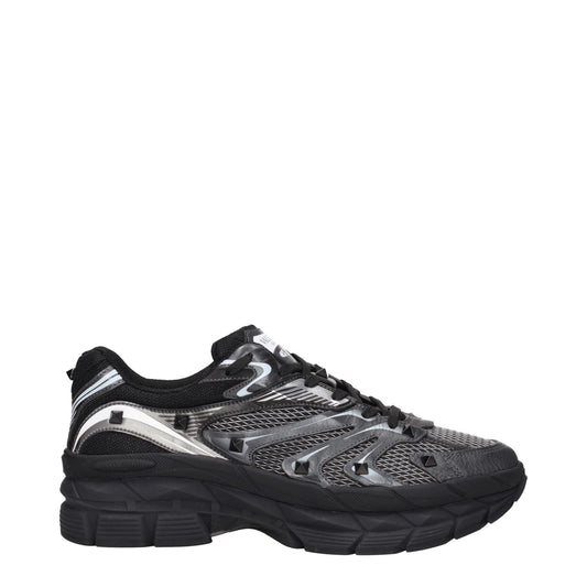 Valentino Garavani Black Fabric Athletic Sneakers with studs, lace-up closure, round toe, rubber sole, mid heels.