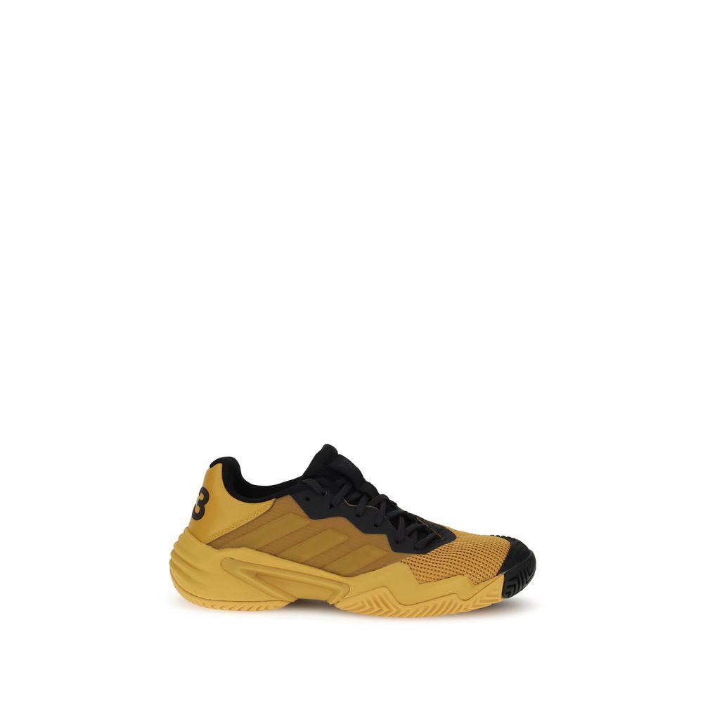 Alt Tag: Y-3 Yellow Rubber Athletic Sneakers with breathable mesh upper and Adiwear outsole for grip, side view on white background