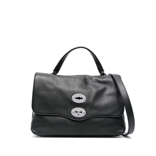 Zanellato Postina Daily medium leather handbag in black calf leather, featuring foldover with turn-clasp, top handle, and detachable strap.