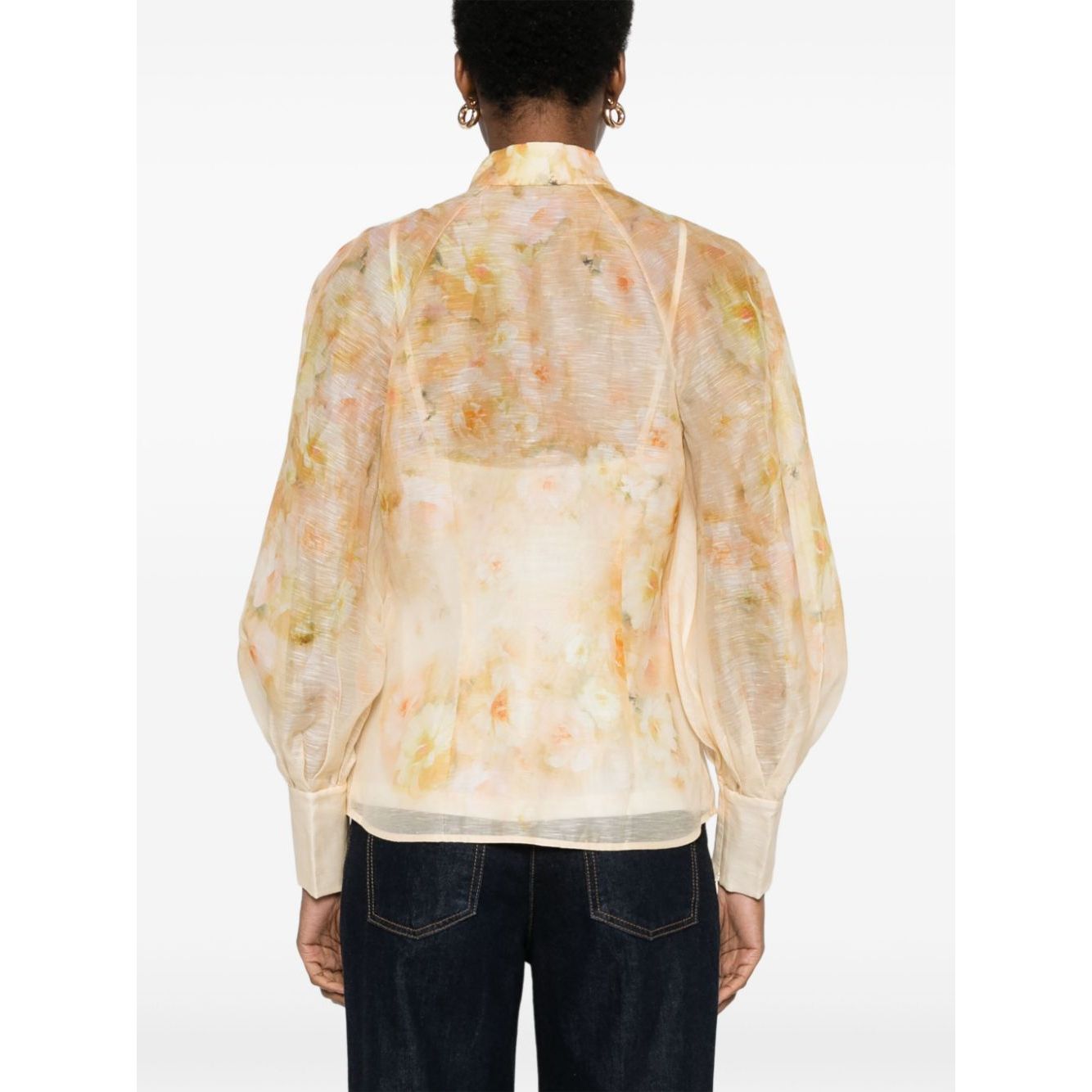 Zimmermann Crush Shirt in light yellow linen-silk blend with floral print, semi-sheer, puff sleeves, and crystal-embellished buttons.